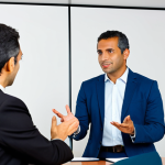Translator/Interpreter at a Business Meeting**

"A professional translator, fully clothed in appropriate business attire, interpreting for a Brazilian executive during a meeting with international clients, set in a modern office conference room, safe for work, appropriate content, perfect anatomy, natural proportions, professional, modest clothing, well-formed hands, proper finger count, natural body proportions, family-friendly."

**